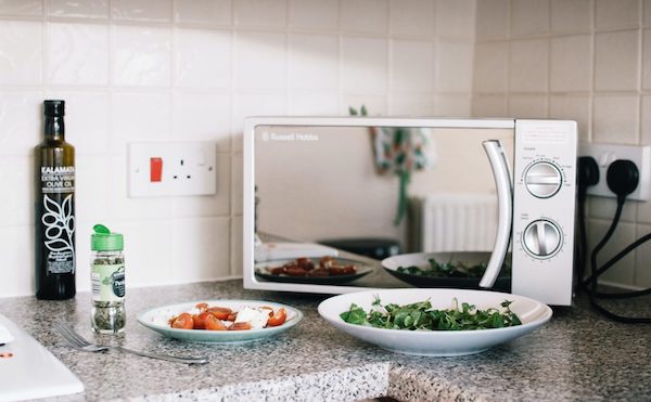 Microwave oven with plates of food