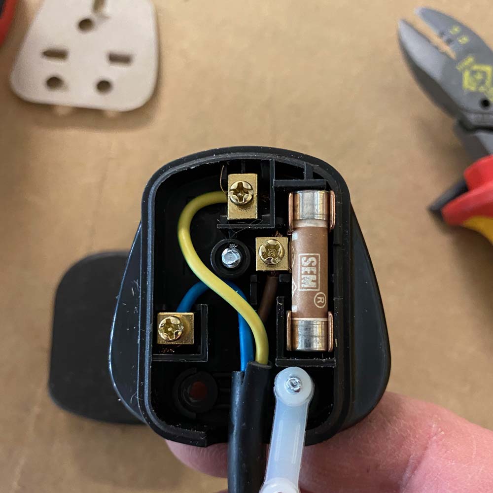 how to wire a plug step 3 showing the wires being screwed into the terminals