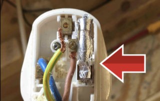 Faulty plug showing home made fuse, found during a formal visual inspection