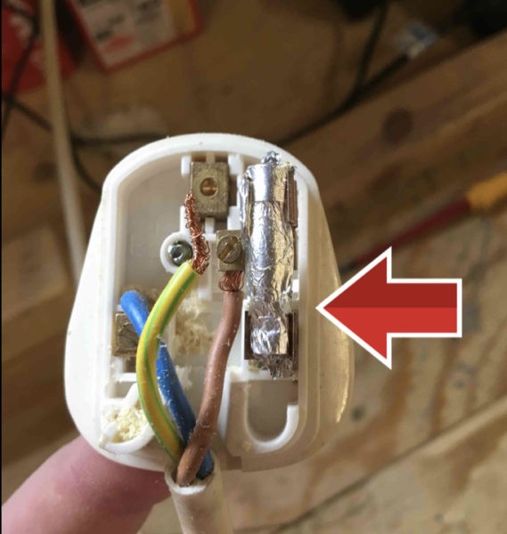 Faulty plug showing home made fuse, found during a formal visual inspection