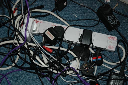messy cables under a desk