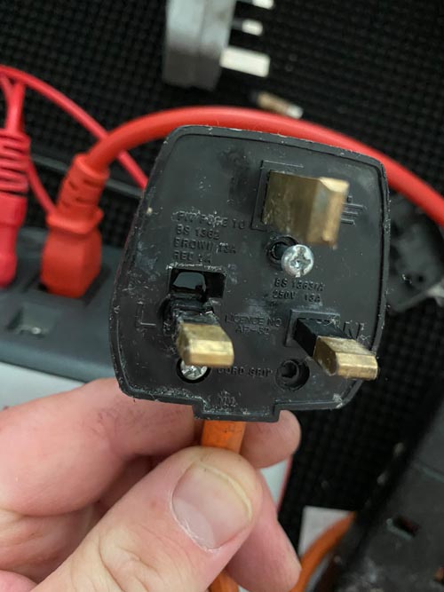 Overheated extension plug outside